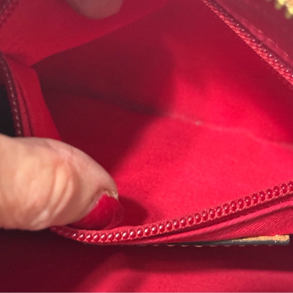 Dooney & Bourke Pebble Grain Crossbody Pouchette bag in a burnt orange color. - Picture 13 of 13